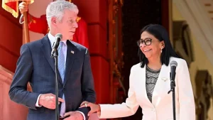 Delcy Rodriguez y un negociador de USA