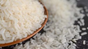 milled-rice-bowl-wooden-spoon-black-cement-floor-664d8ebb-focus-0-0-896-504